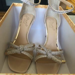 Champagne color jeweled shoes.